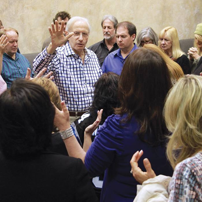 Sid Roth praying in Canada for the Messianic Vision Canada